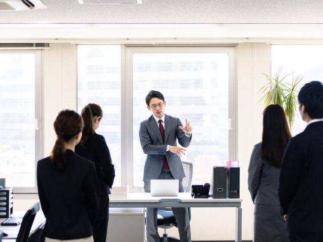 Asian,Manager,Speeching,In,Front,Of,Employees.,Autocratic,President.