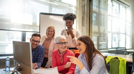 Shot,Of,A,Group,Of,Businesspeople,Sitting,Together,In,A