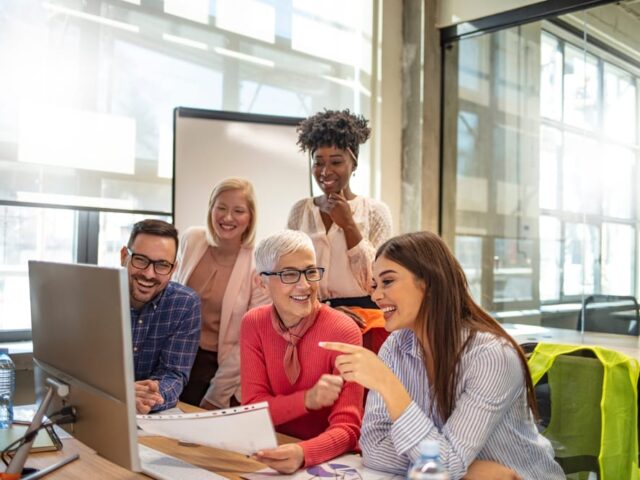 Shot,Of,A,Group,Of,Businesspeople,Sitting,Together,In,A