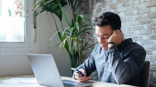 Unhappy,Young,Man,Looking,At,Phone,,Feeling,Nervous,Of,Bad
