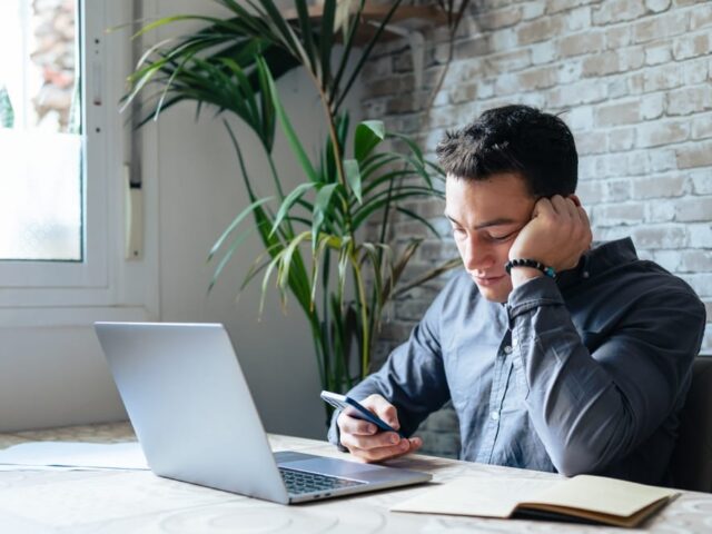 Unhappy,Young,Man,Looking,At,Phone,,Feeling,Nervous,Of,Bad