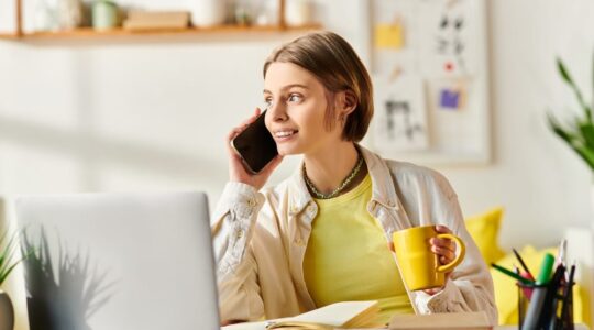 A,Teenage,Girl,Sitting,At,A,Desk,,Intently,Talking,On