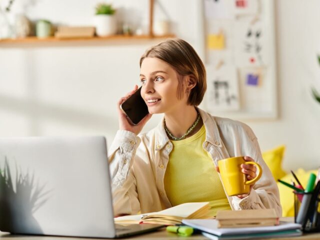 A,Teenage,Girl,Sitting,At,A,Desk,,Intently,Talking,On