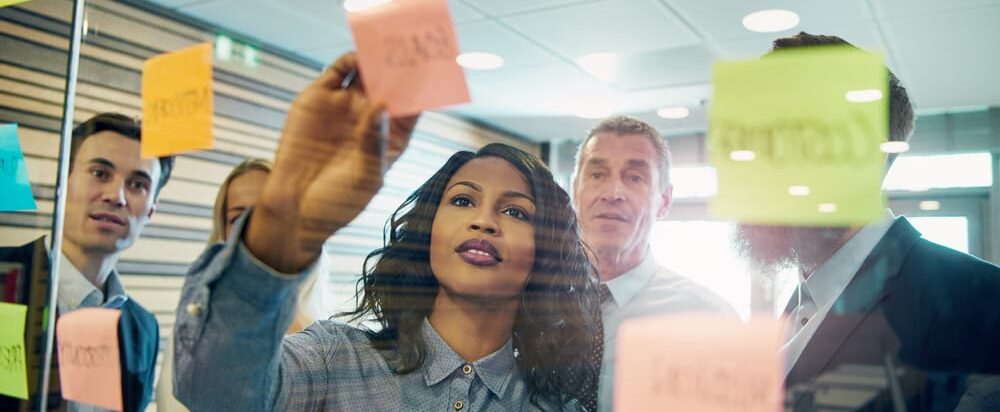 Young,Black,Businesswoman,Explaining,Business,Strategy,To,The,Staff,In