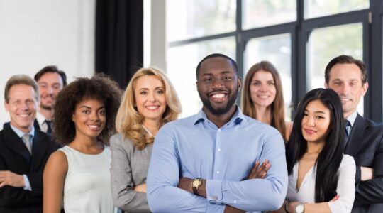 African,American,Businessman,Boss,With,Group,Of,Business,People,In