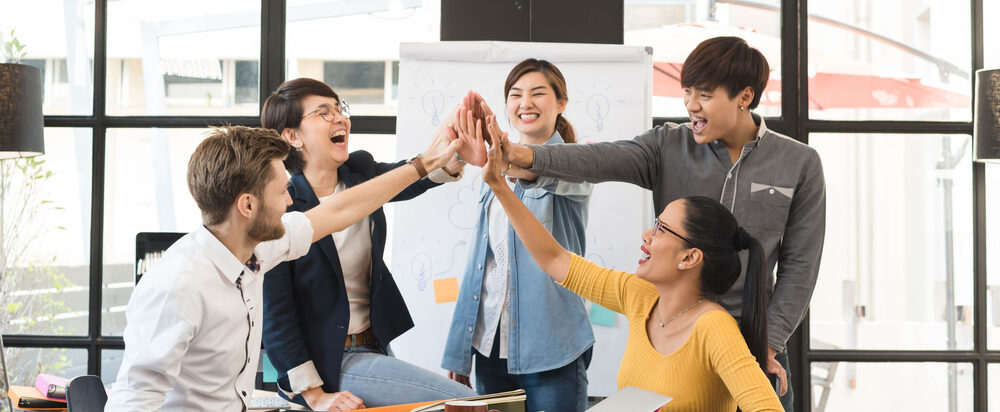 Group,Of,Five,Creative,Workers,Giving,Each,Other,High-five,With