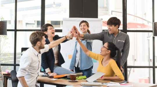Group,Of,Five,Creative,Workers,Giving,Each,Other,High-five,With